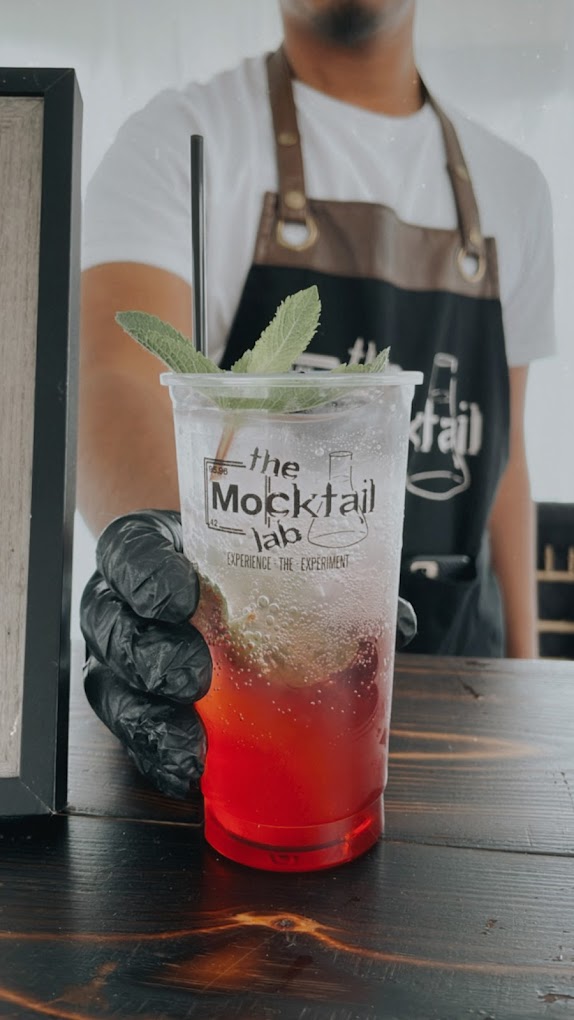 Bartender pouring a fresh mocktail service